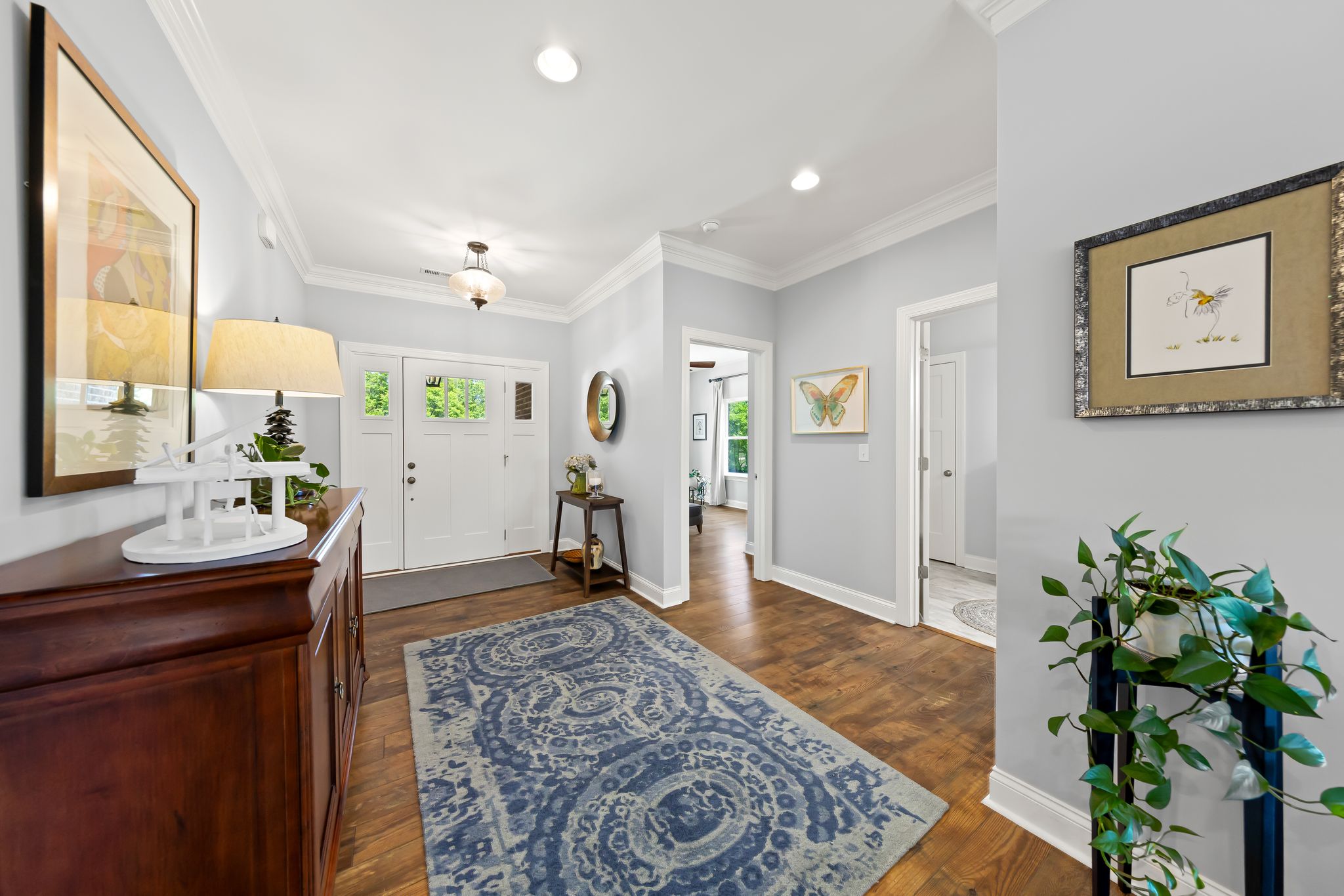 Welcoming foyer with hardwood floors