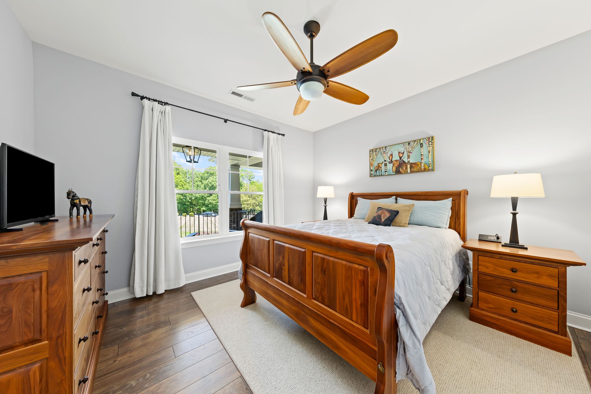 Secondary bedroom with hardwood floors